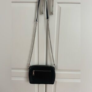 Black crossbody bag .